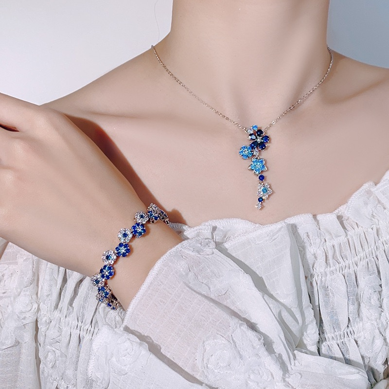 Juego de pulsera y collar de cristal de flor azul con púas